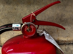 Close-up view of a fire extinguisher.