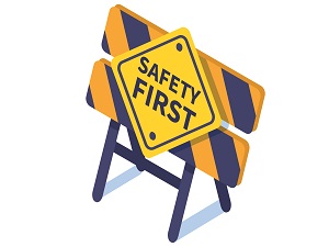 A barricade with a sign on it that says Safety First.