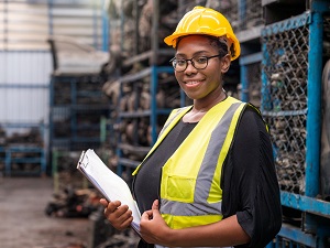 Worker wearing PPE in an industrial environment.
