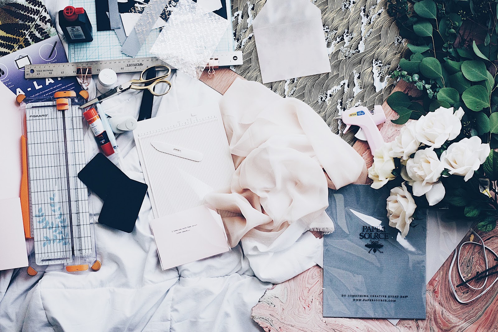 compilation of clothes, flowers and other memorable items in preparation for designing a shadow box of personal effects
