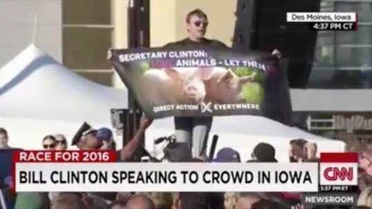 Matt disrupting a Bill Clinton speech with a message of animal liberation