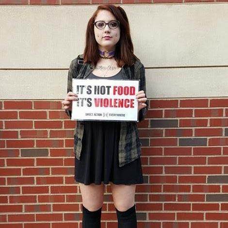 Keira Devine, organizer for Direct Action Everywhere Philadelphia, holding an