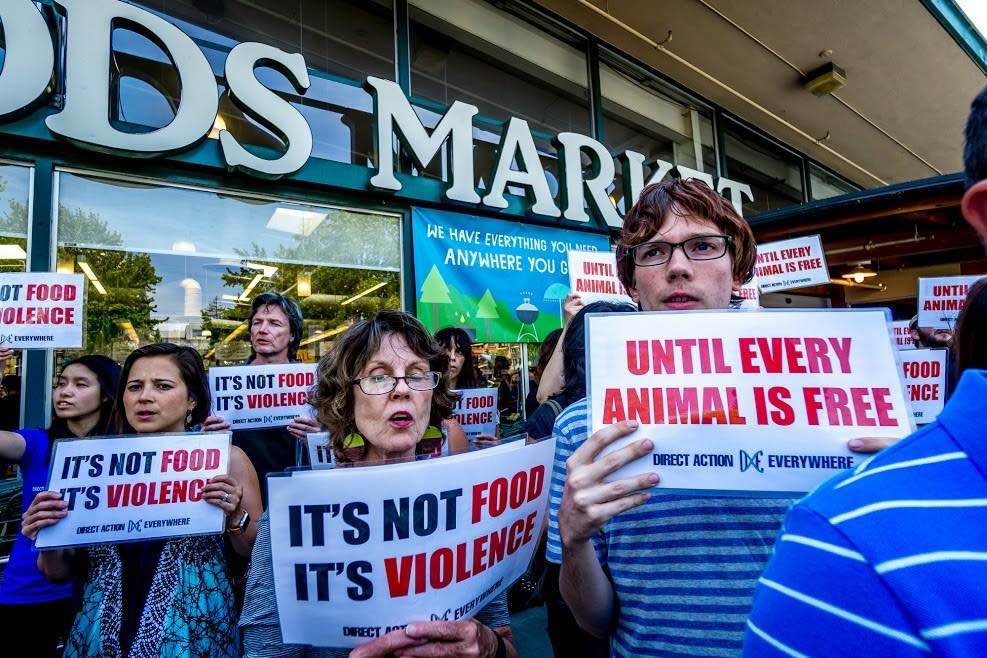 Leslie at a DxE demonstration outside of a Whole Foods Market