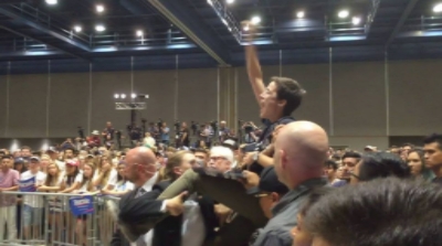 Kearney disrupting a Bernie Sanders rally