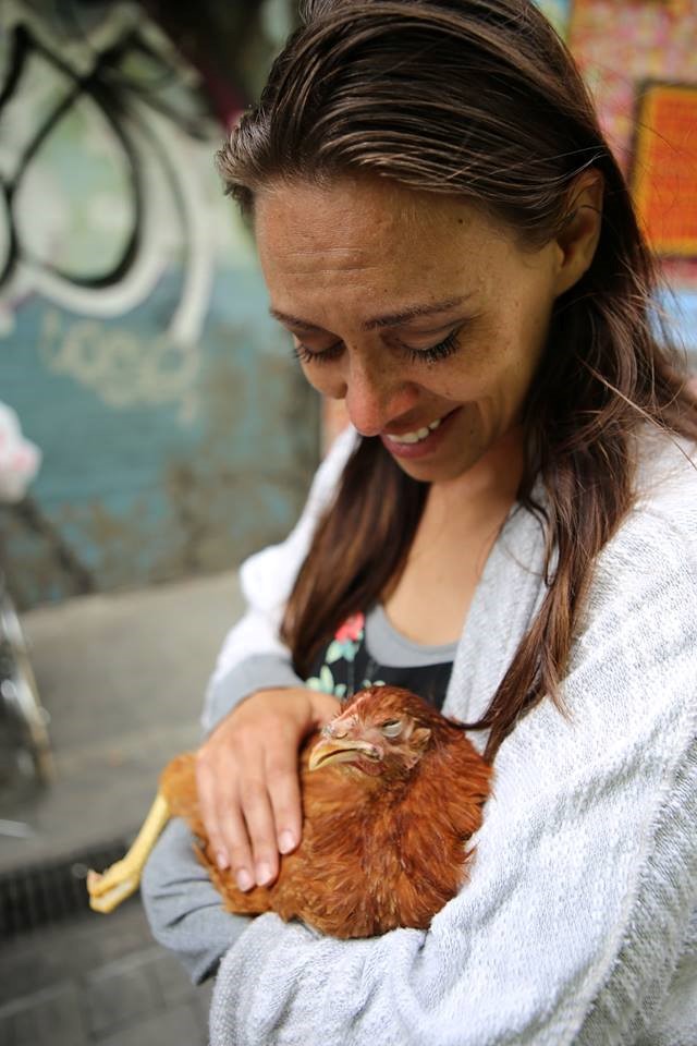 Activist Julianne Perry holds one of the six rescued chickens