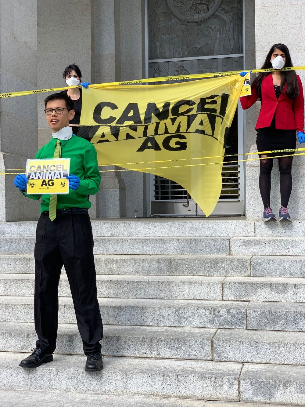 Chinese American activist Rocky Chau speaks at Tuesday’s protest