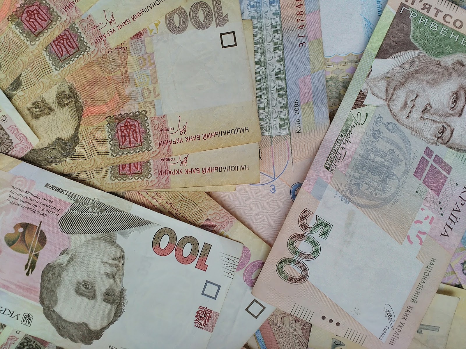 Ukrainian currency notes spread on a desk