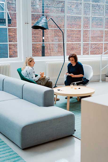 2 woman working at a lounge