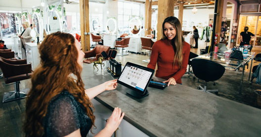 Image of two people in an office building a Facebook Advertising campaign.