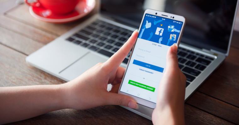 Image of a person using Facebook Ads on their cell phone.