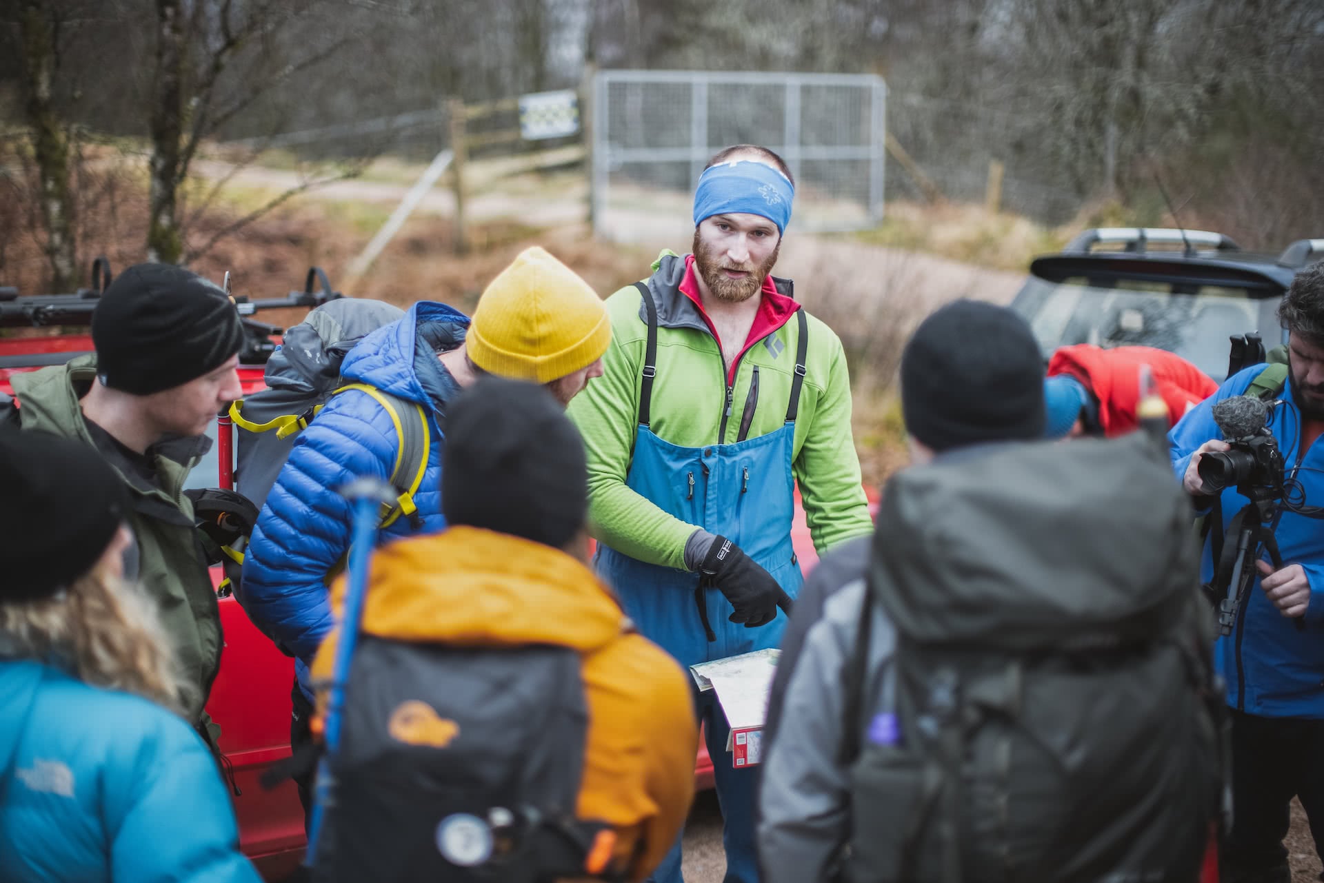 hikers read map before climbing ben nevis