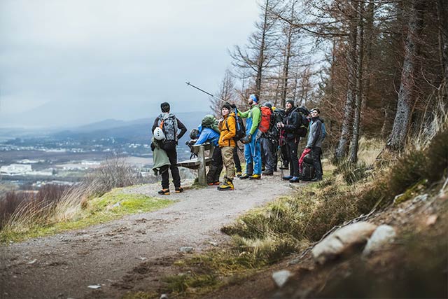 Mountain guide shows direction Ben Nevis