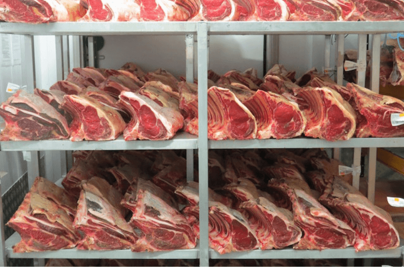 Image of ribs of beef on shelves at catering butcher