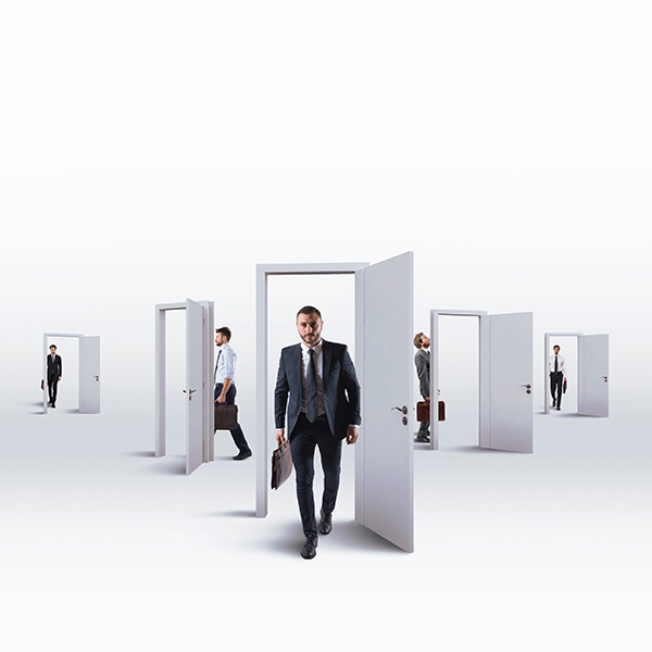 photo: business men walking through open door frames