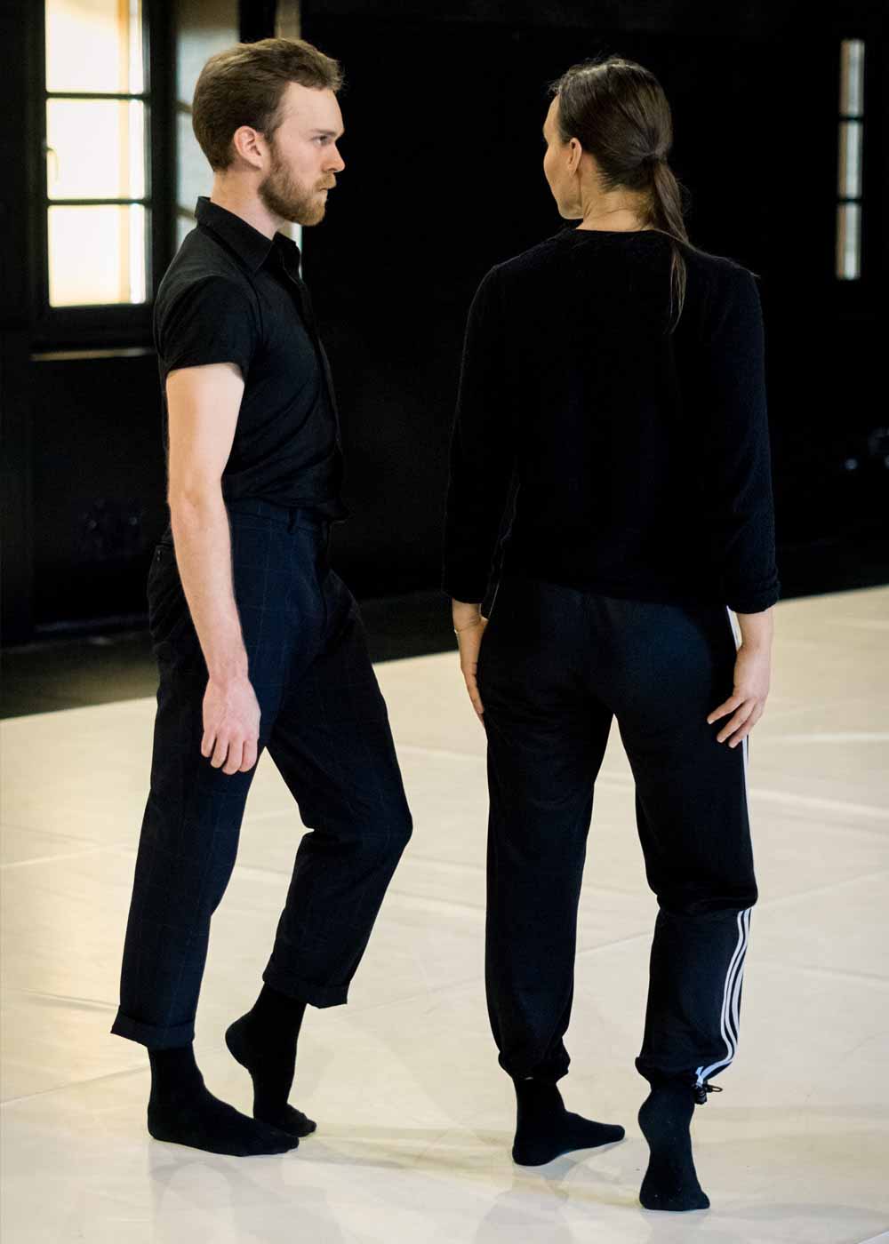 Anna Kempin and a male dancer looking at each other and WIlder Shores rehearsal, composed by Michèle Murray