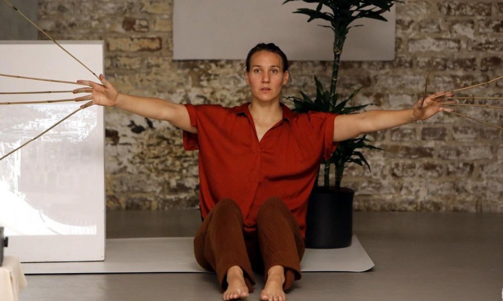 Anna Kempin captured performing at Atlas 2 contemporary dance project while sitting on the ground
