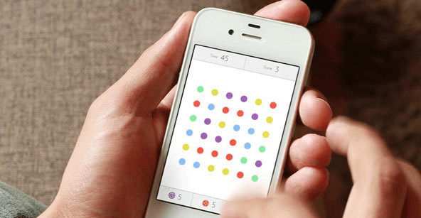 Screenshot of iPhone game with colored dots.