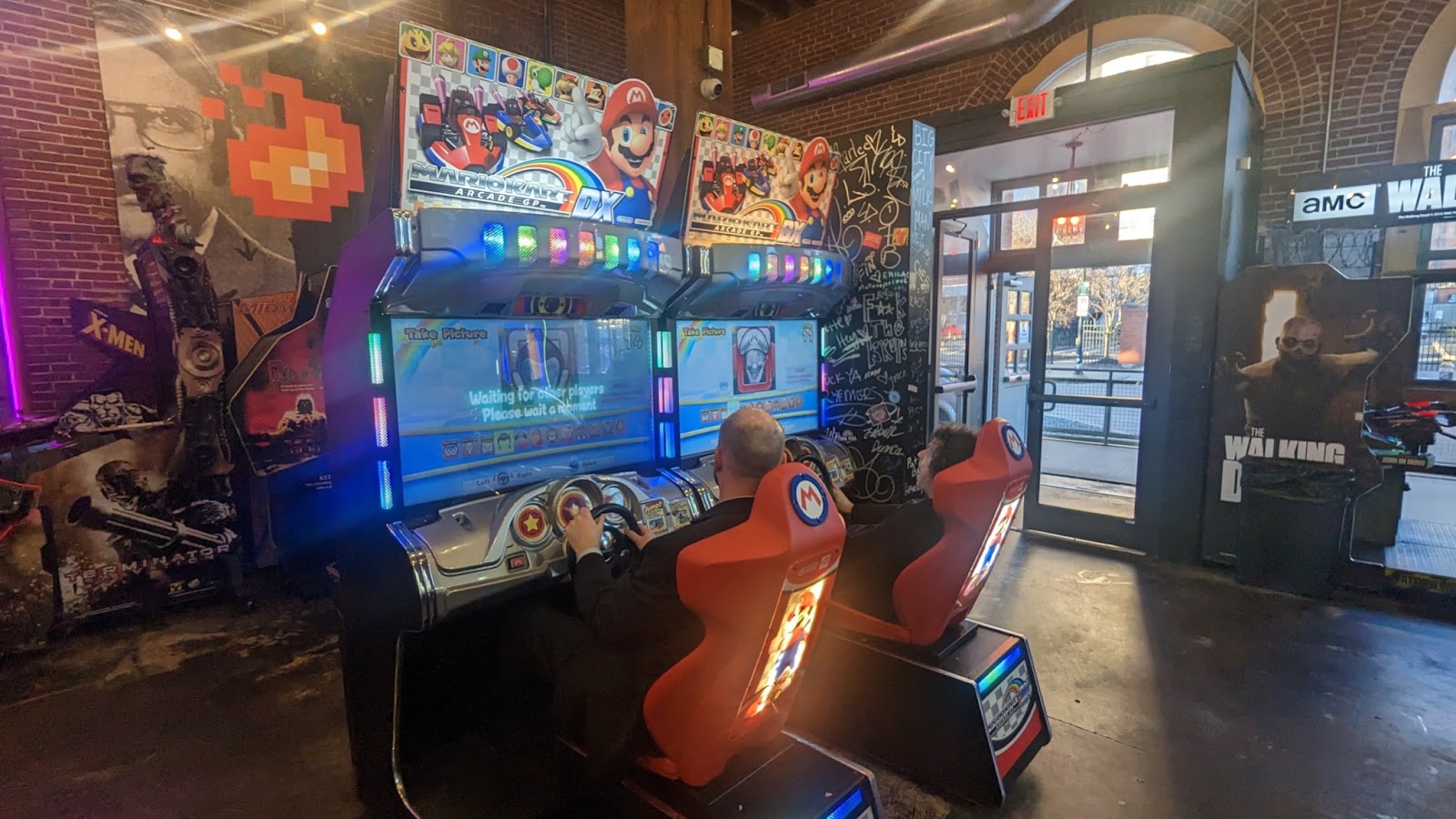 Integrity employees playing Mario Cart video game