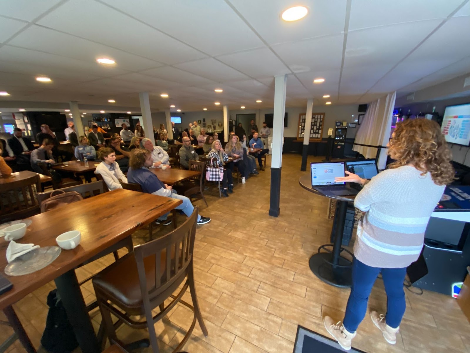 Integrity's Kim House giving a marketing update to the Carpet Weaver's employees.