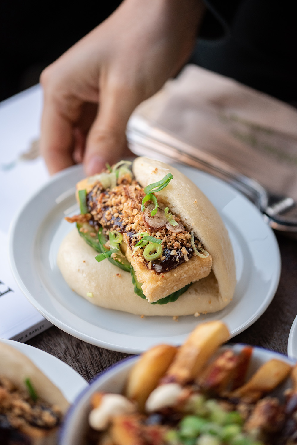 A marcro style close up of a pork belly bao bun. Lunch at The Pond in Brighton