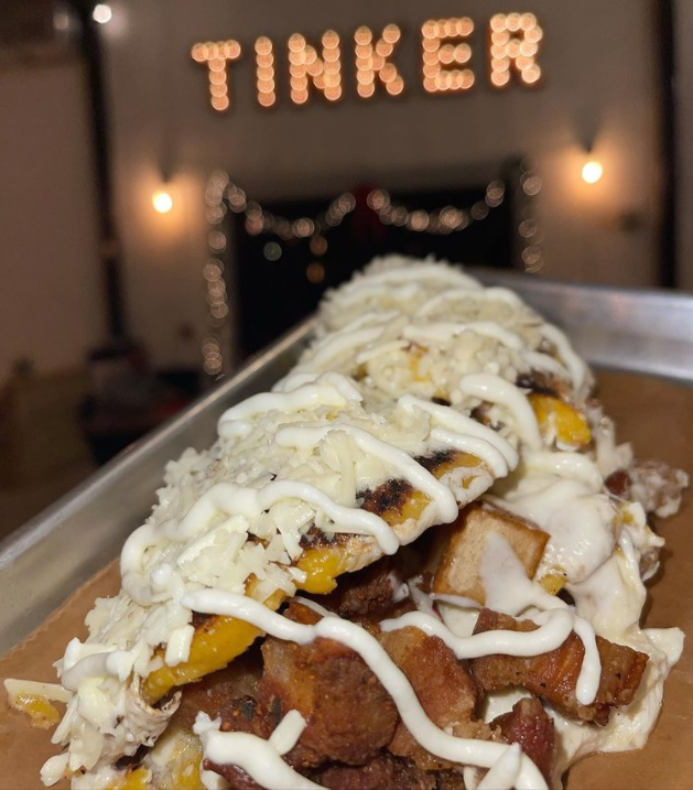 Tinker Food Truck Venezuelan Street Food's Cachapa with Chicharron pictured in front of Tinker's New brick and mortar restaurant located in the heart of downtown Gainesville