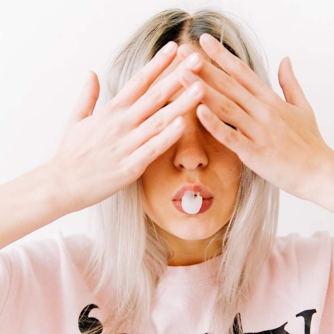Blonde women covering her eyes for a suprise