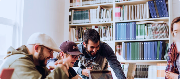 Workers looking at a computer together