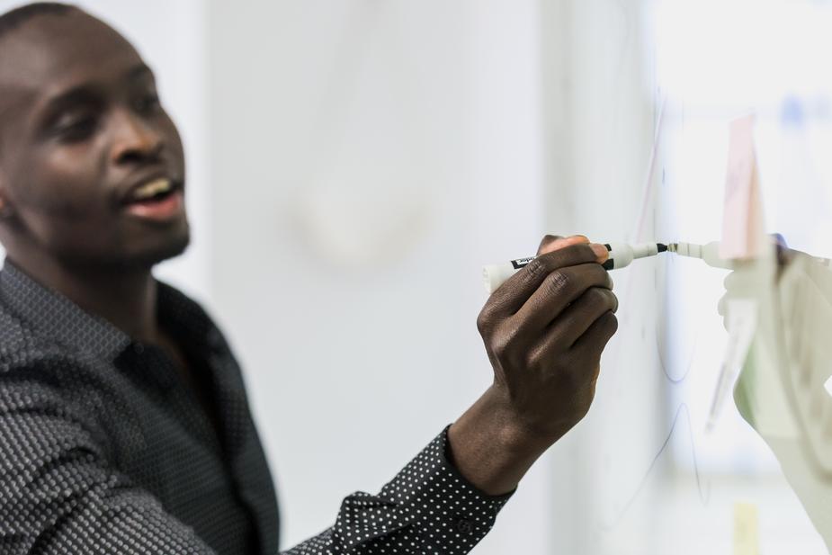 man-write-on-whiteboard
