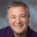 a man smiling for the camera