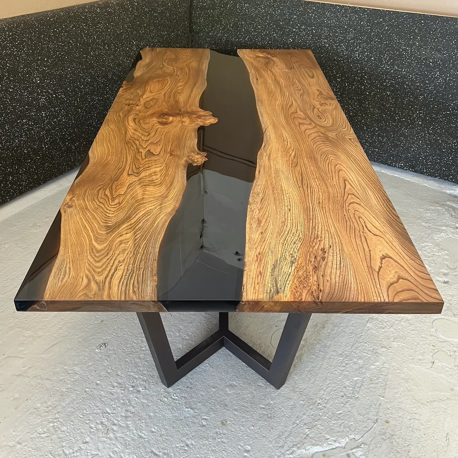 elm and translucent black luxury dining river table.