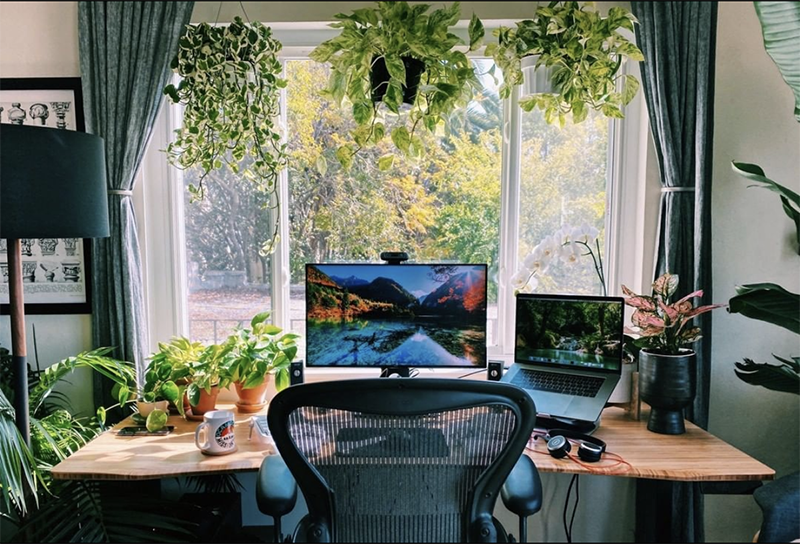 wood office desk in front of window