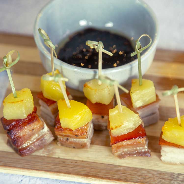 NZ pork belly bites, topped with grilled pineapple NZ Pork