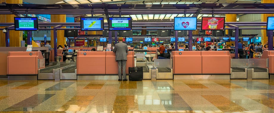Man in business suit at check-in counter