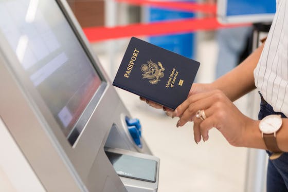 Woman preparing to scan passport