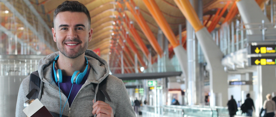 Loyal airline customer with boarding pass at airport