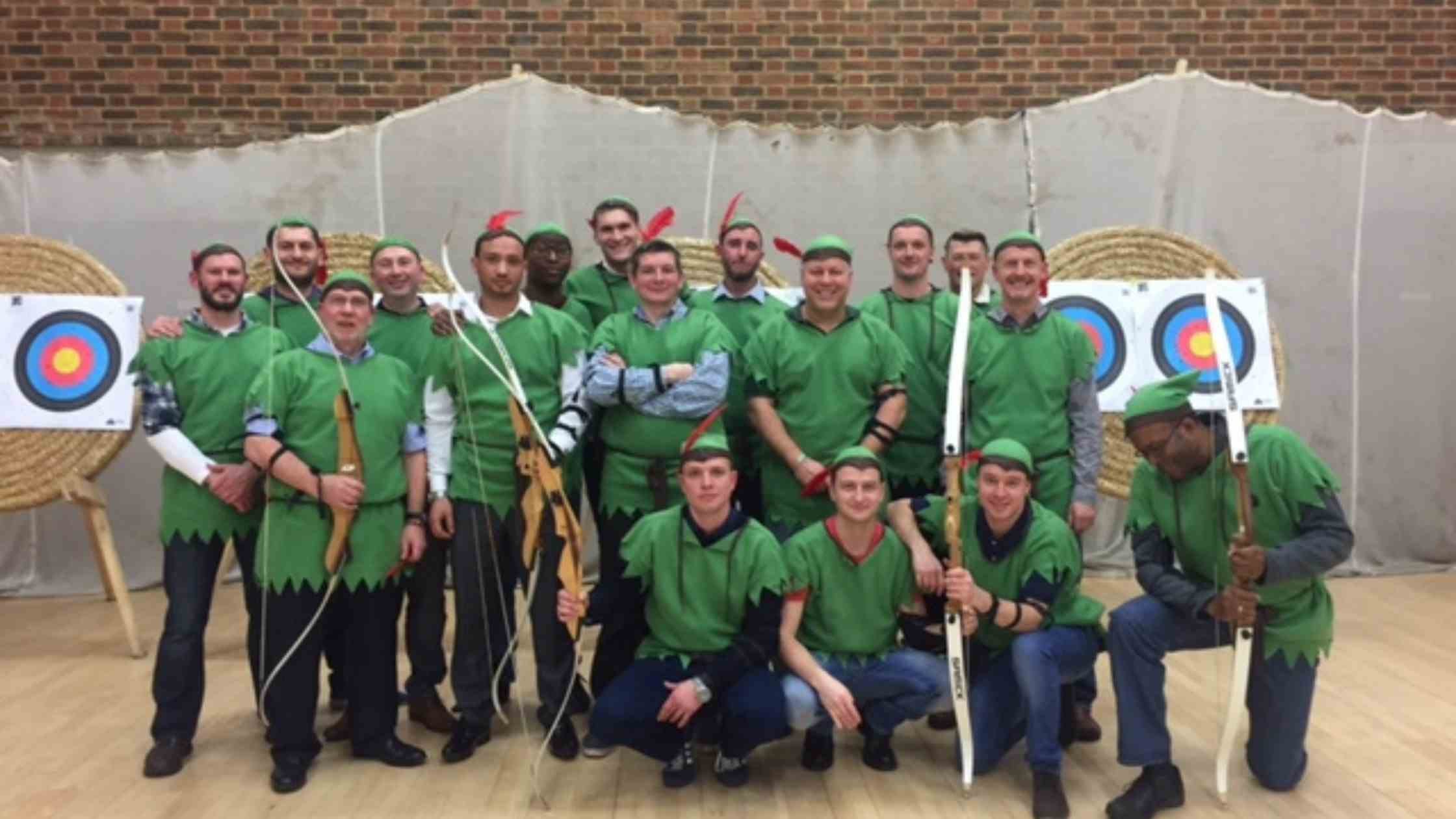 A group of men in robin hood customs