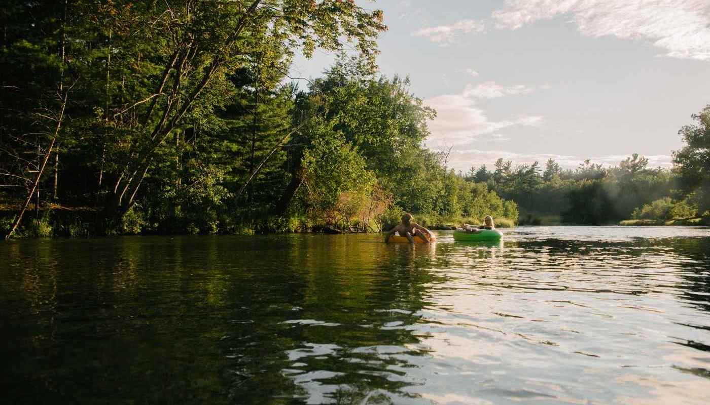 People tubing down a river.