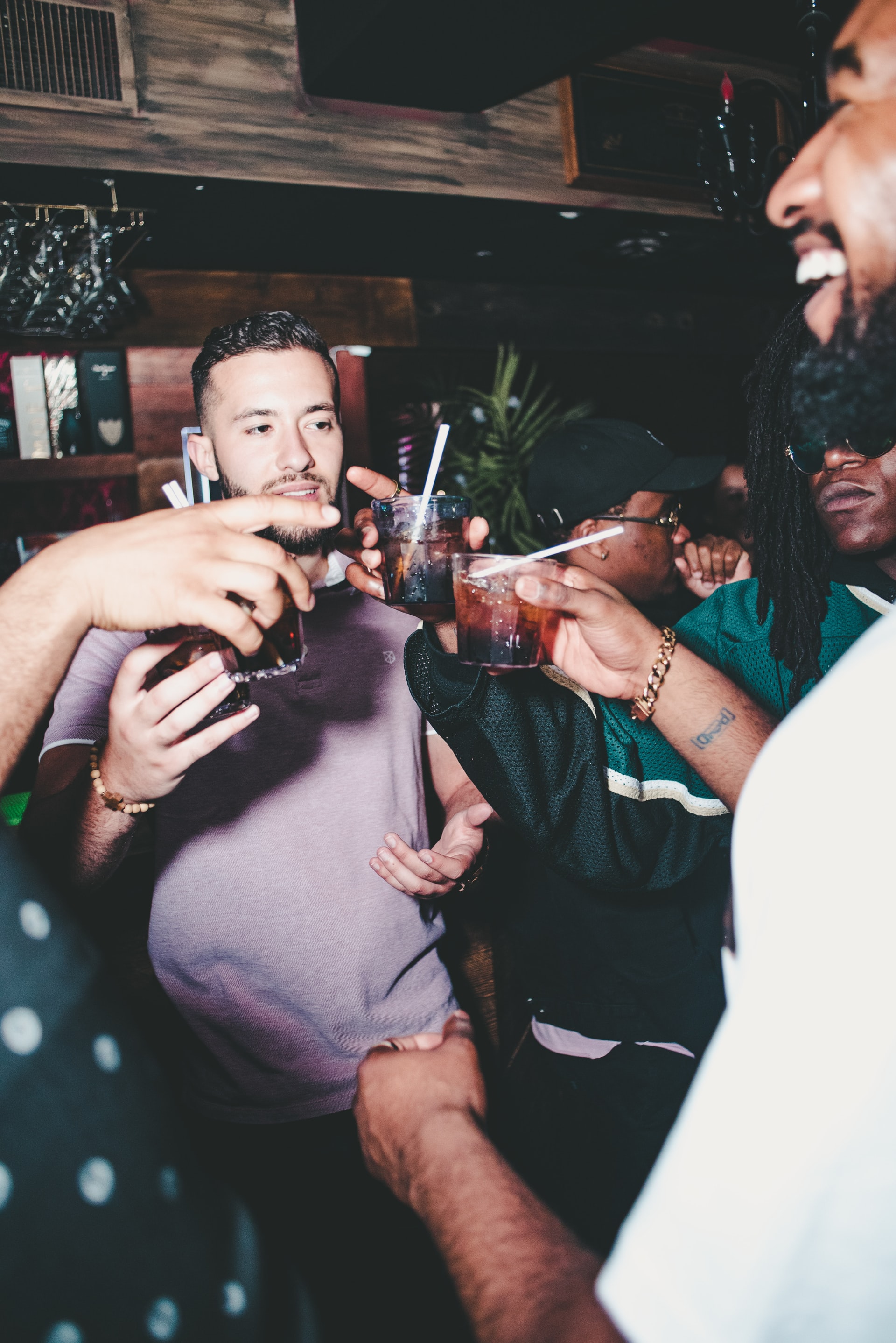 Group of men cheersing drinks
