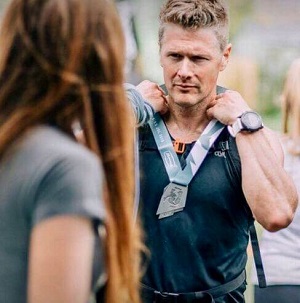 a man with a medal around his neck
