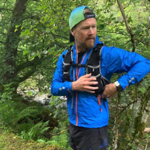 A man with a running vest on