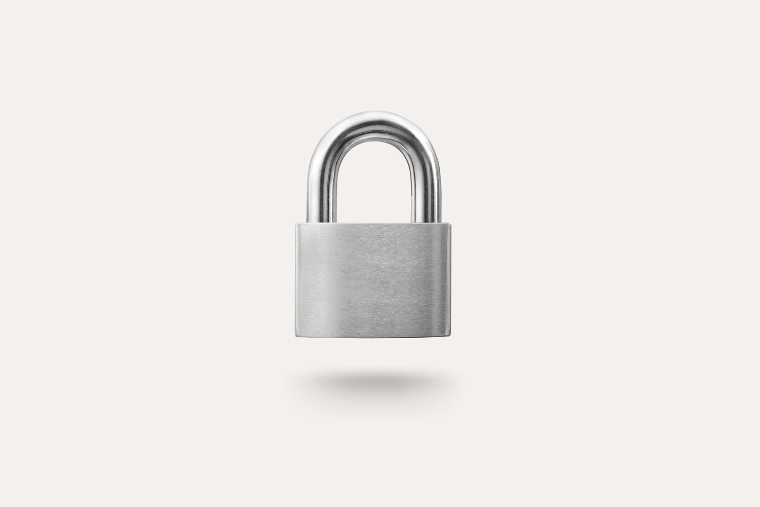 A closed padlock on a beige background