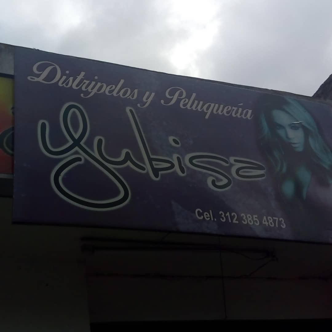 Aviso publicitario que dice "Distripelos y Peluquería Jubisa"