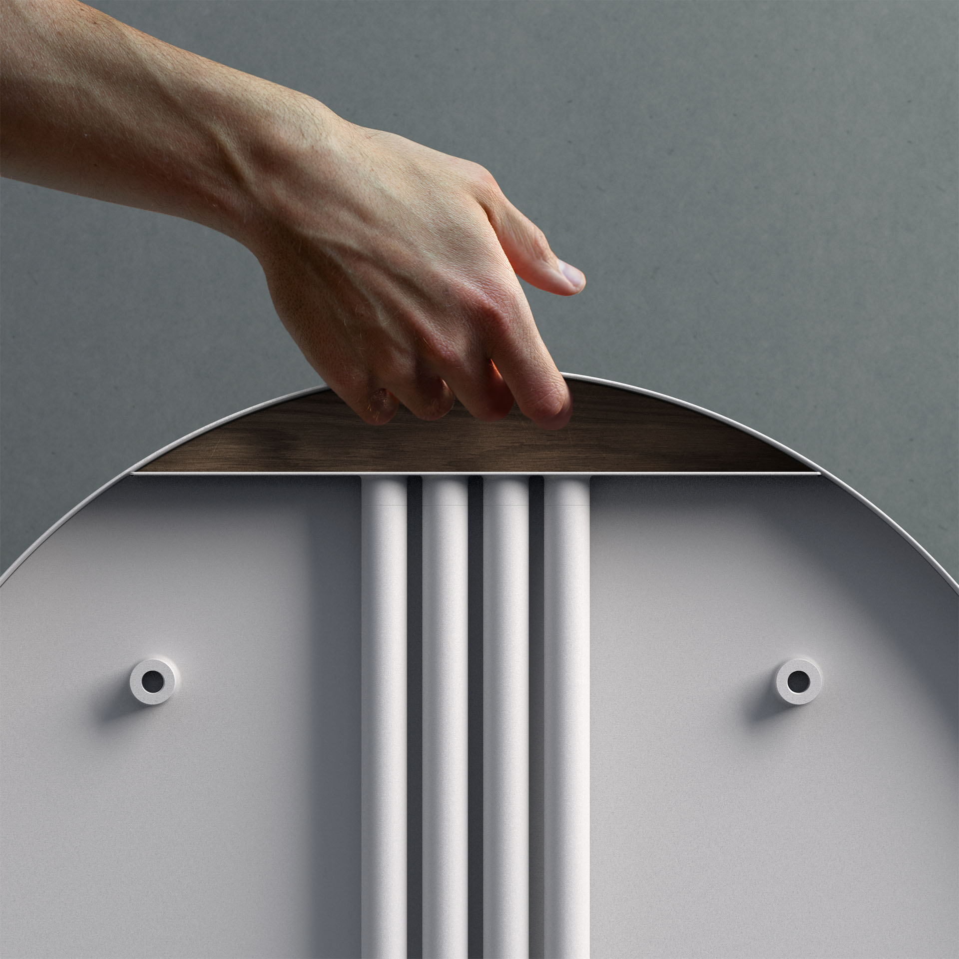 A hand holding the table in its compact configuration with the legs stowed inside the table top