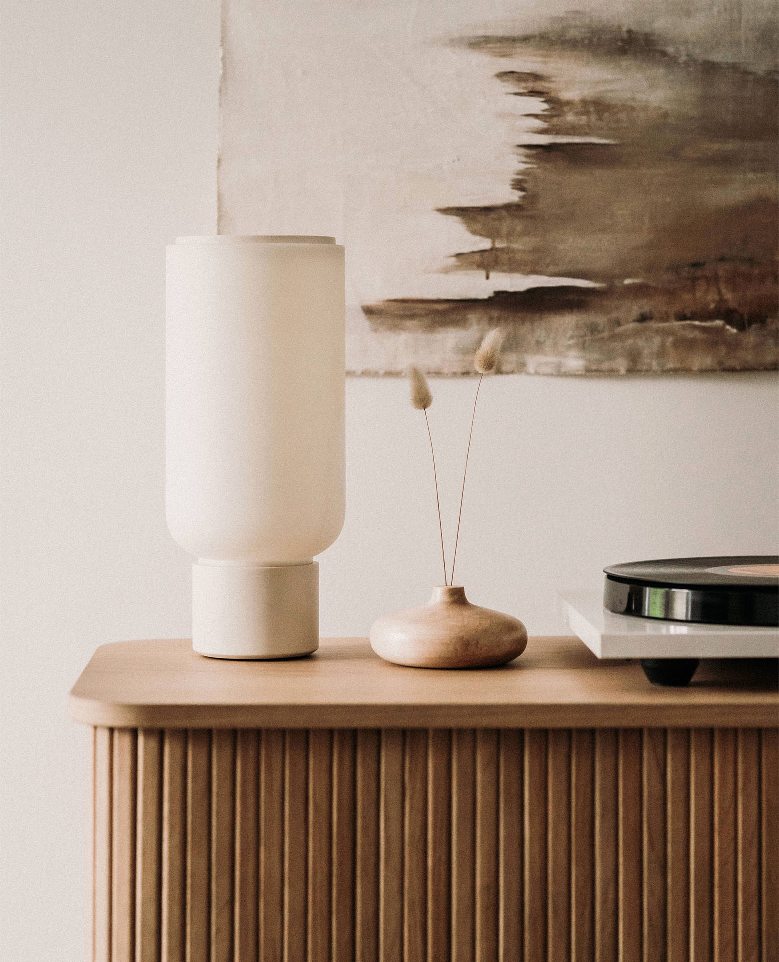 Arpeggio Table Light for Gantri, placed on a minimal sideboard
