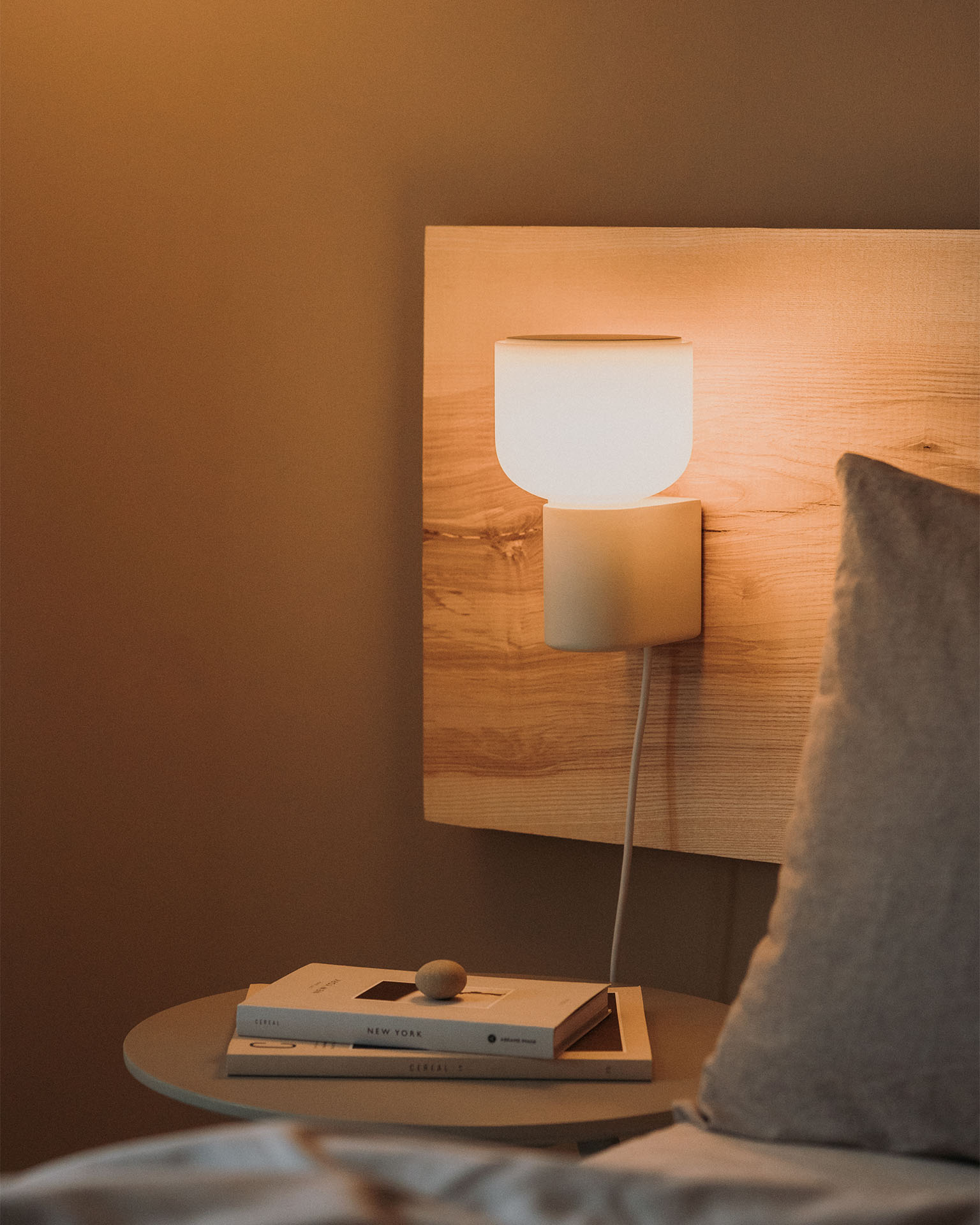 Arpeggio Wall Light for Gantri, mounted about a bedside table