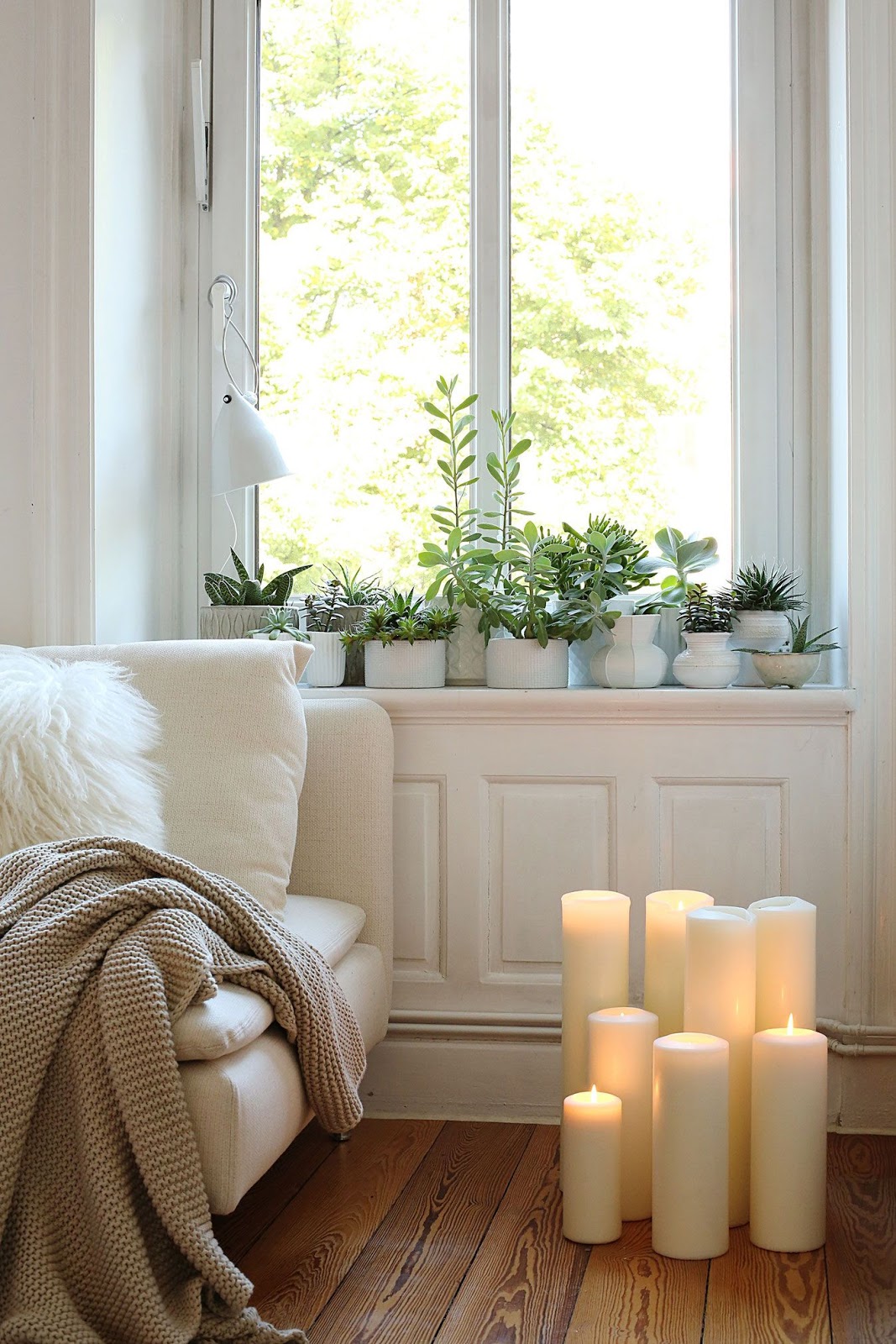 sala de estar decoração plantas e velas