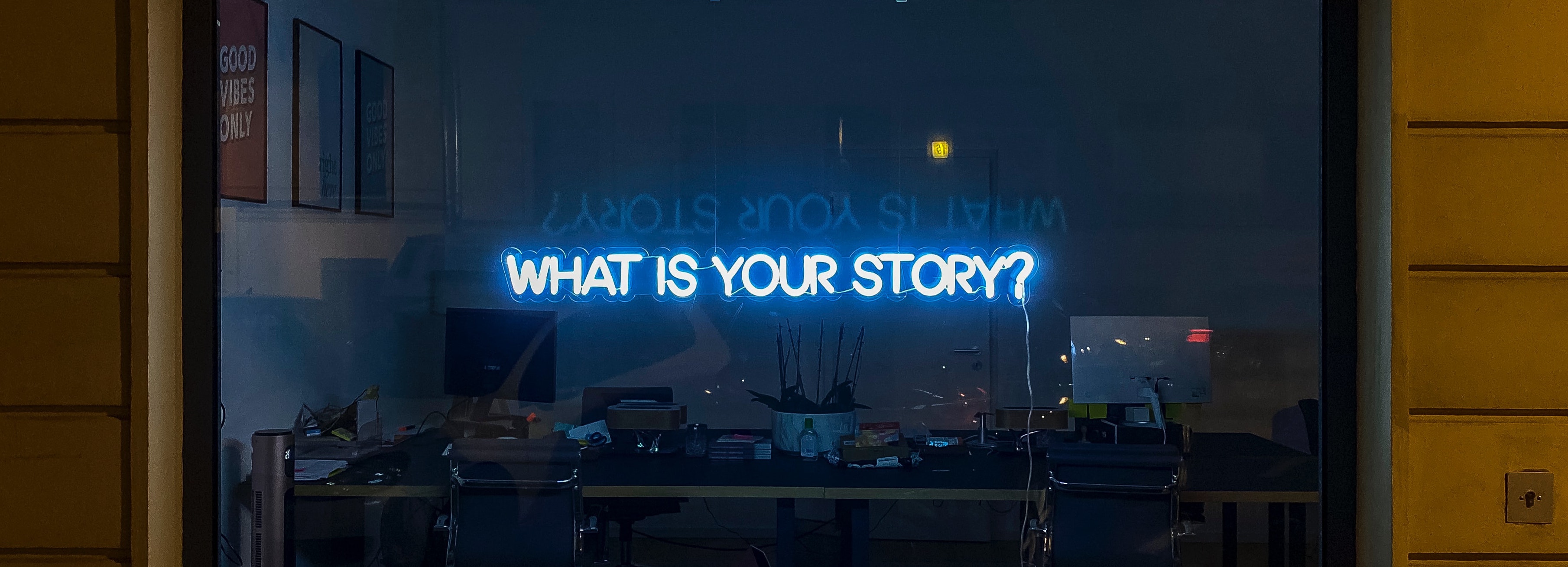 Neon Sign with text "What Is Your Story"
