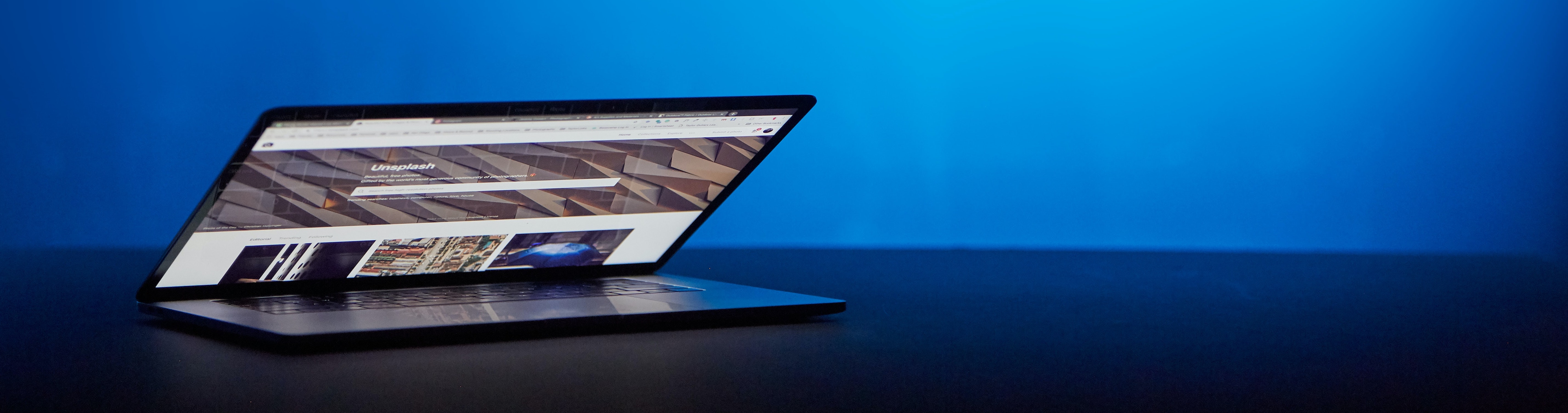 Laptop with Unsplash website for professional images