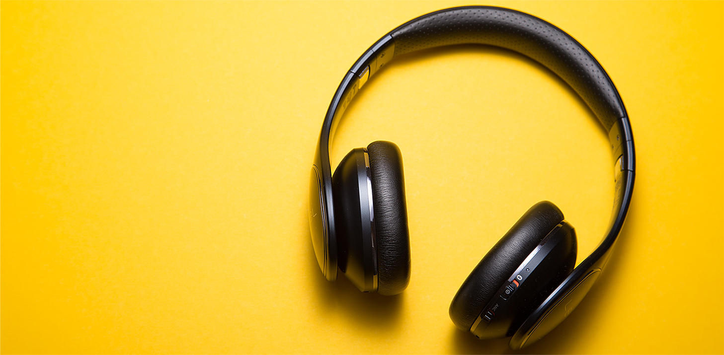 Headphones displayed against a yellow background