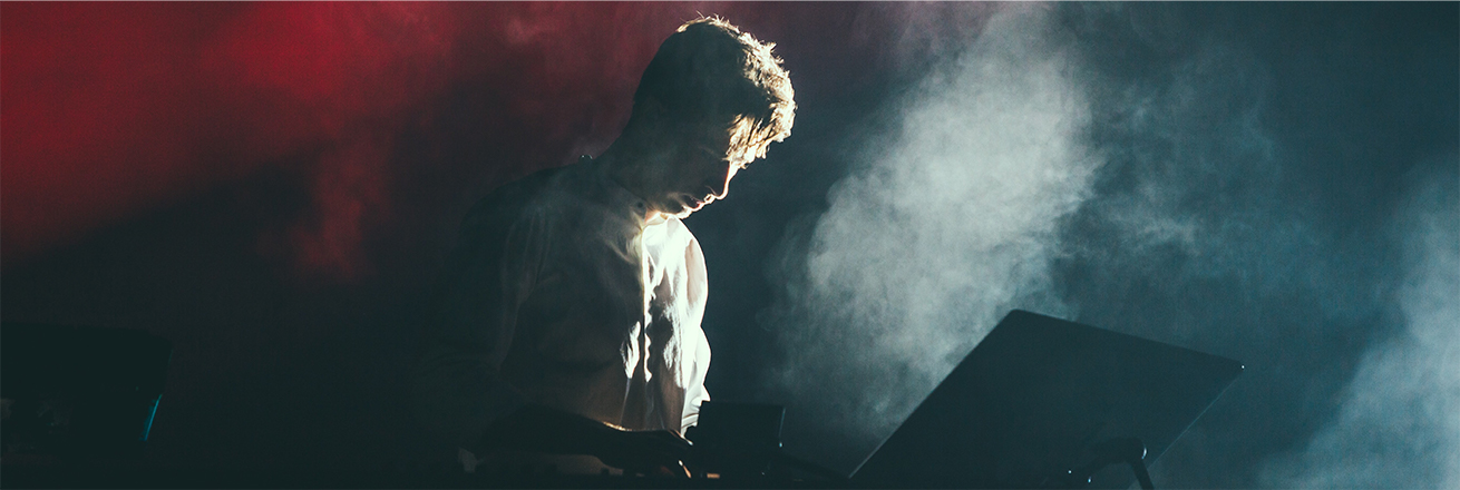 Image of a musician in stage light
